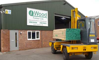 A picture of the side loader outside the iwood timber merchants building