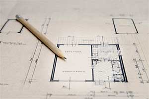 Architect plans with a pencil on them